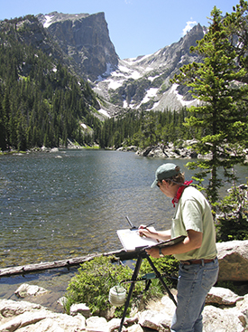 Photo of John Hulsey painting watercolor at Dream Lake, Colo.