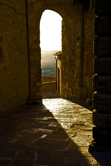 Photo of sunlit archway, Montepulciano, Tuscany, by John Hulsey