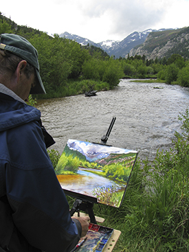 Photo of the artist John Hulsey painting in Rocky Mountain National Park, Colo.