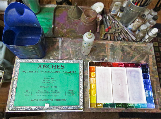 photo of watercolor palette and Arches paper block. © J. Hulsey