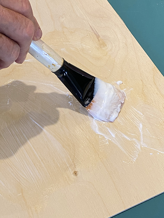 Applying Glue to Backing Panel
